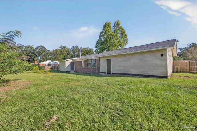 a view of a room with wooden walls