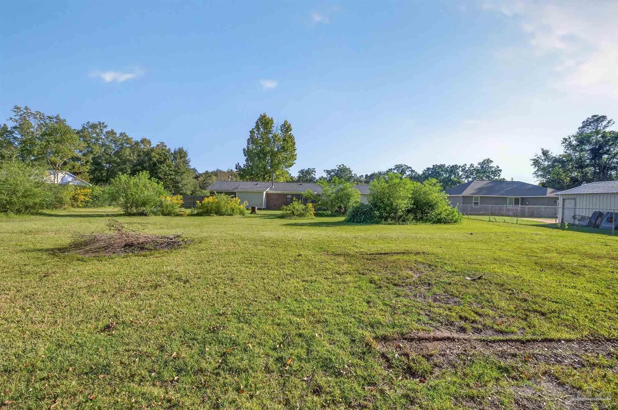 1120 Muscogee Road Cantonment, FL 32533 - Photo 36 of 38 a view of an outdoor space and a yard