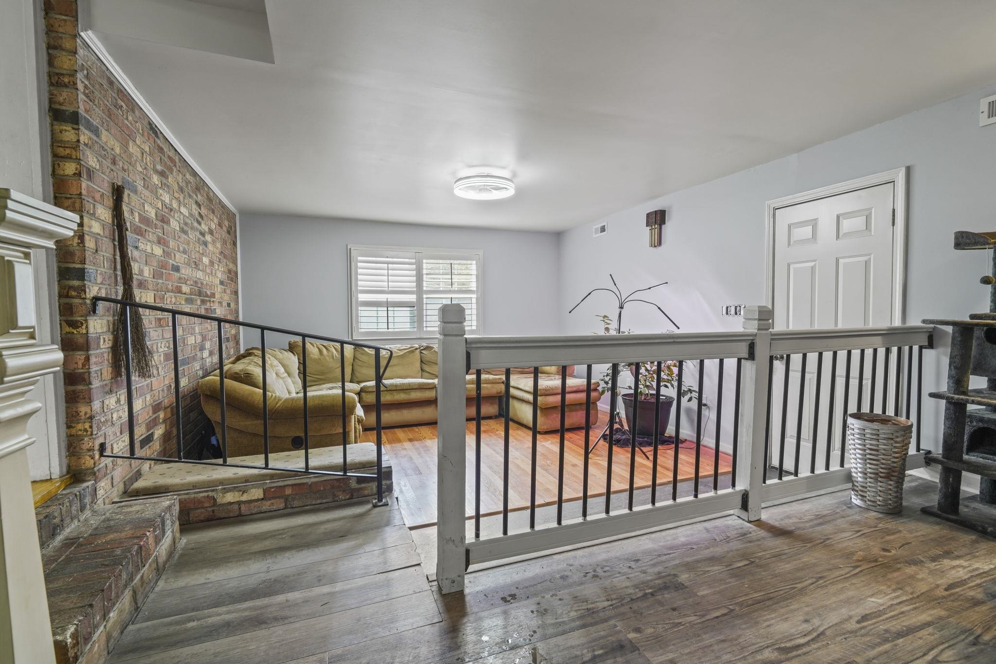 408 Rosemary Street Georgetown, SC 29440 - Photo 11 of 34 Hall with hardwood / wood-style flooring and an upstairs landing