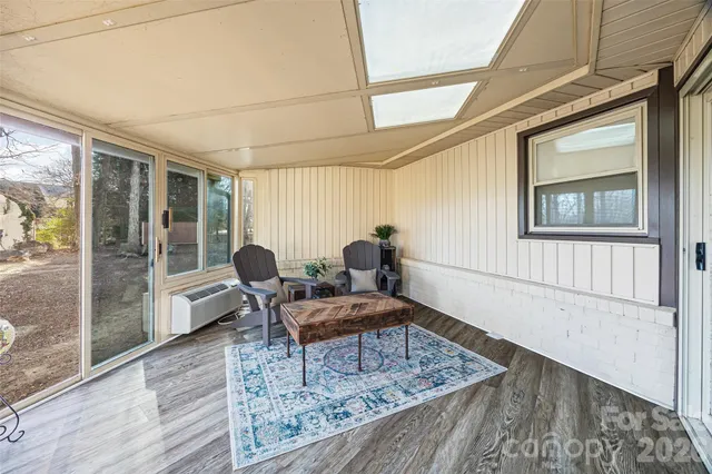 a living room with furniture and a table