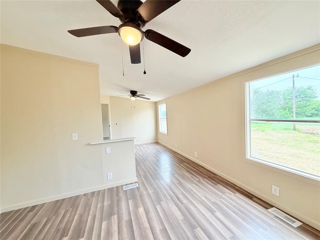 9721 Limestone Joshua, TX 76058 - Photo 30 of 36 a view of empty room with wooden floor and fan