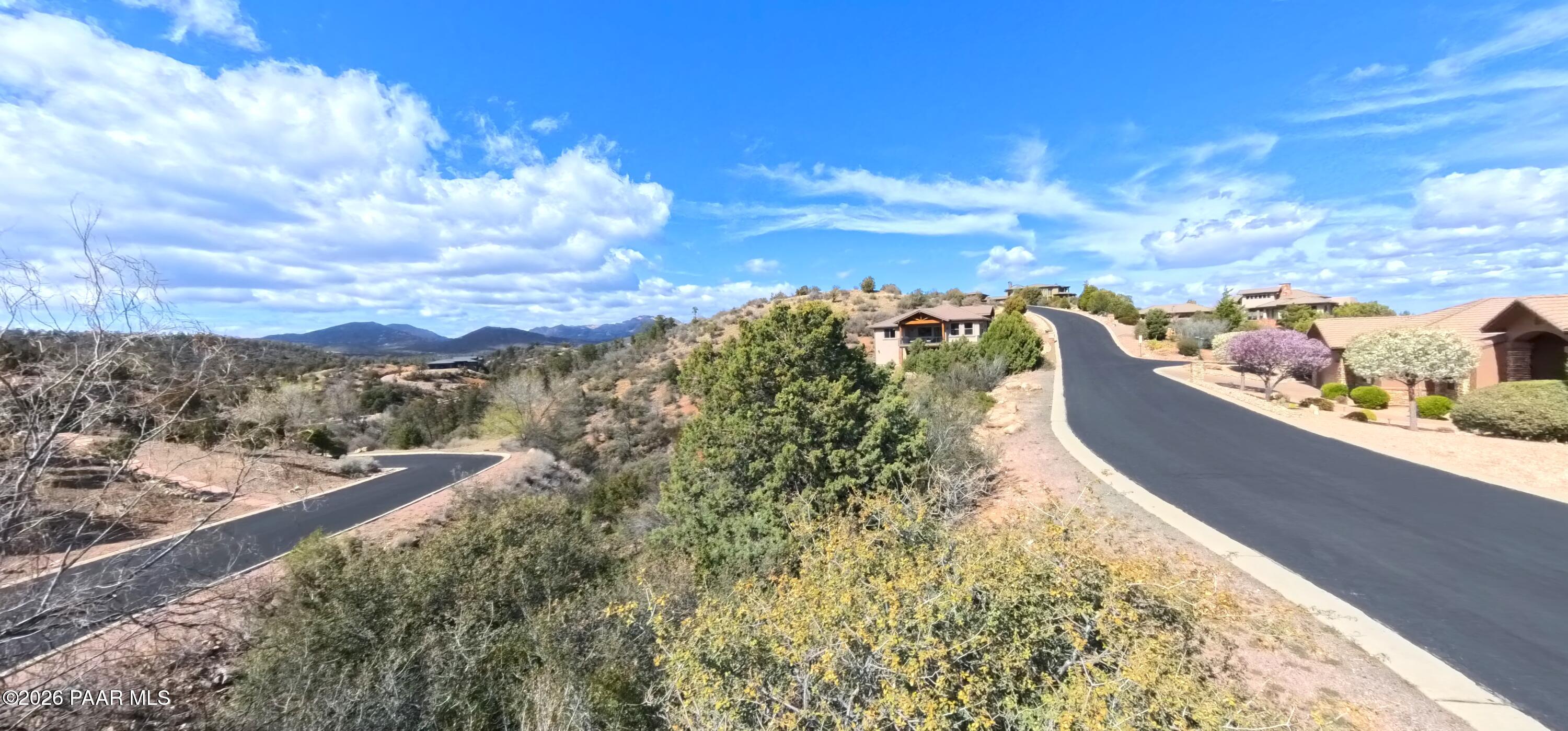 1997 Promontory Prescott, AZ 86305 - Photo 18 of 36 a view of a lake with a building in the back