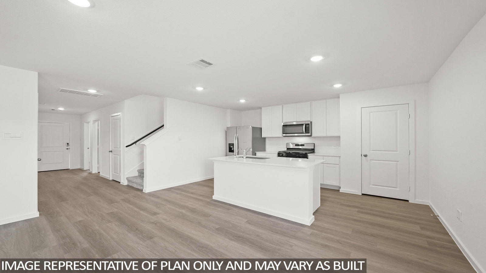 116 Baby Calf Roping Road Jarrell, TX 76537 - Photo 4 of 23 A well-lit open-concept kitchen and living area showcases an inviting atmosphere with contemporary finishes.