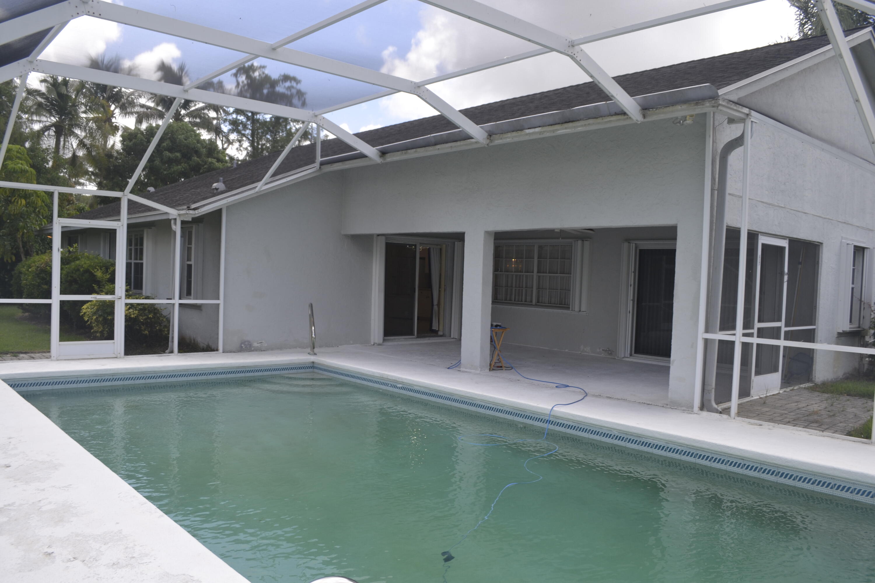 1104 Raintree Lane Wellington, FL 33414 - Photo 14 of 30 Pool Patio screen enclosed
