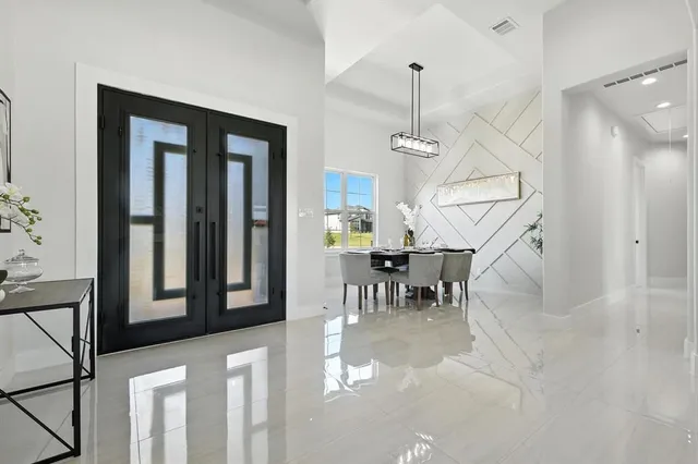 a view of entryway and hall with dining room
