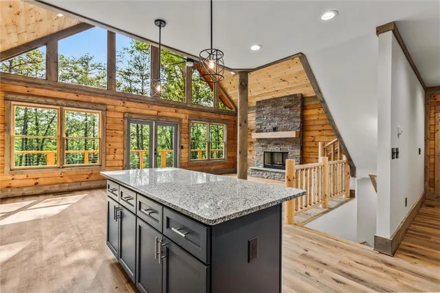 a view of a room with wooden floor and large windows