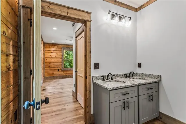 a dining room with wooden floor and windows