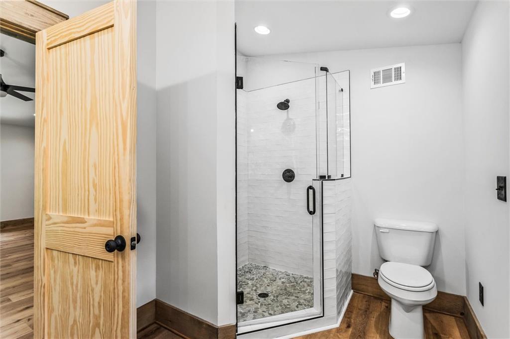 1725 Cherokee Gold Trail Ball Ground, GA 30107 - Photo 32 of 57 a bathroom with a shower toilet and sink