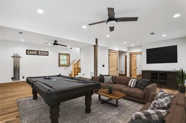a bathroom with a bathtub shower sink vanity and a toilet