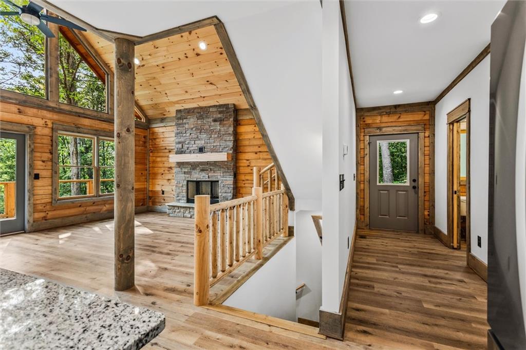 1725 Cherokee Gold Trail Ball Ground, GA 30107 - Photo 33 of 57 a view of a hallway with wooden floor and staircase