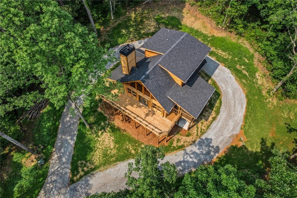 1725 Cherokee Gold Trail Ball Ground, GA 30107 - Photo 49 of 57 an aerial view of a house with a garden