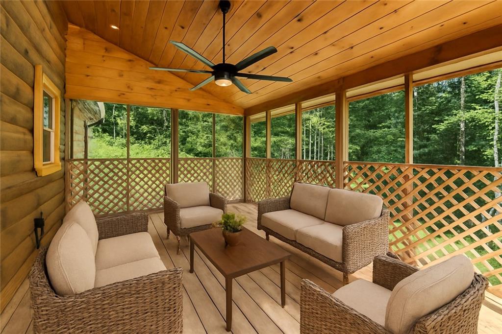 1725 Cherokee Gold Trail Ball Ground, GA 30107 - Photo 5 of 57 a balcony with furniture and a garden view