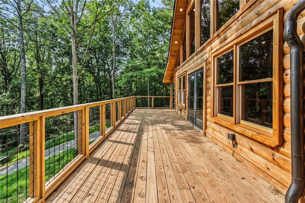 1725 Cherokee Gold Trail Ball Ground, GA 30107 - Photo 52 of 57 a view of balcony with wooden floor