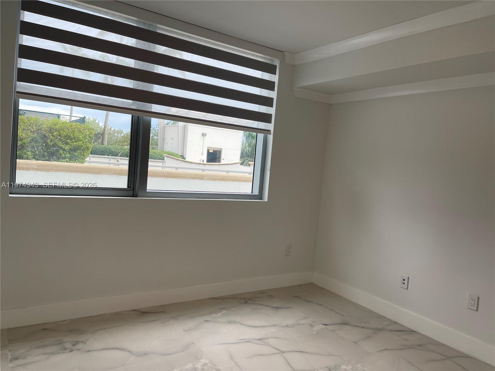 2681 North Flamingo Road, Unit 401S Sunrise, FL 33323 - Photo 11 of 18 an empty room with a window