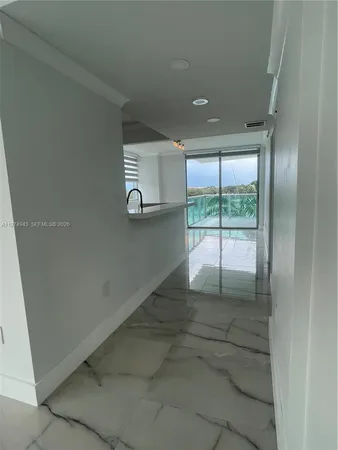 a kitchen with stainless steel appliances a refrigerator and a stove top oven
