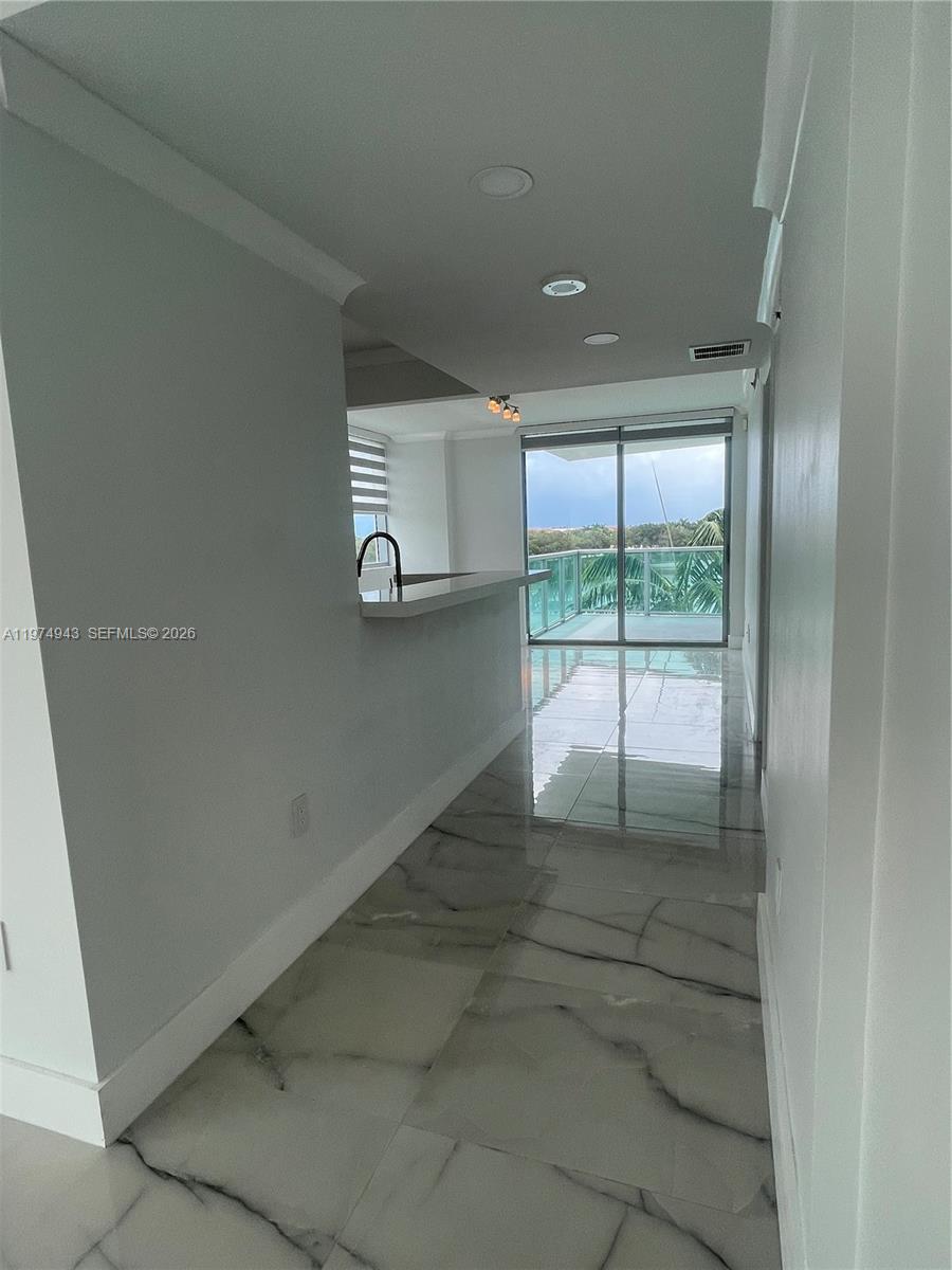 2681 North Flamingo Road, Unit 401S Sunrise, FL 33323 - Photo 12 of 18 an empty room with windows
