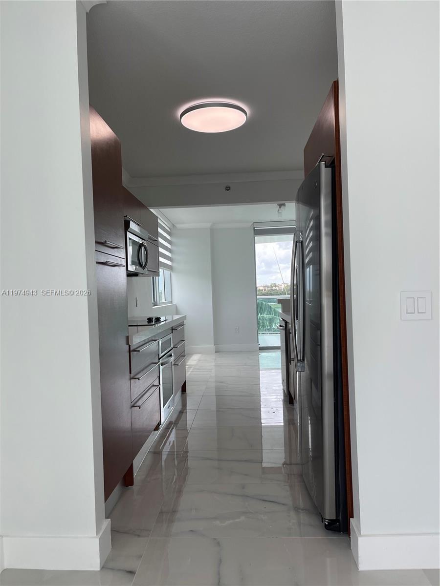 2681 North Flamingo Road, Unit 401S Sunrise, FL 33323 - Photo 18 of 18 a kitchen with refrigerator and window