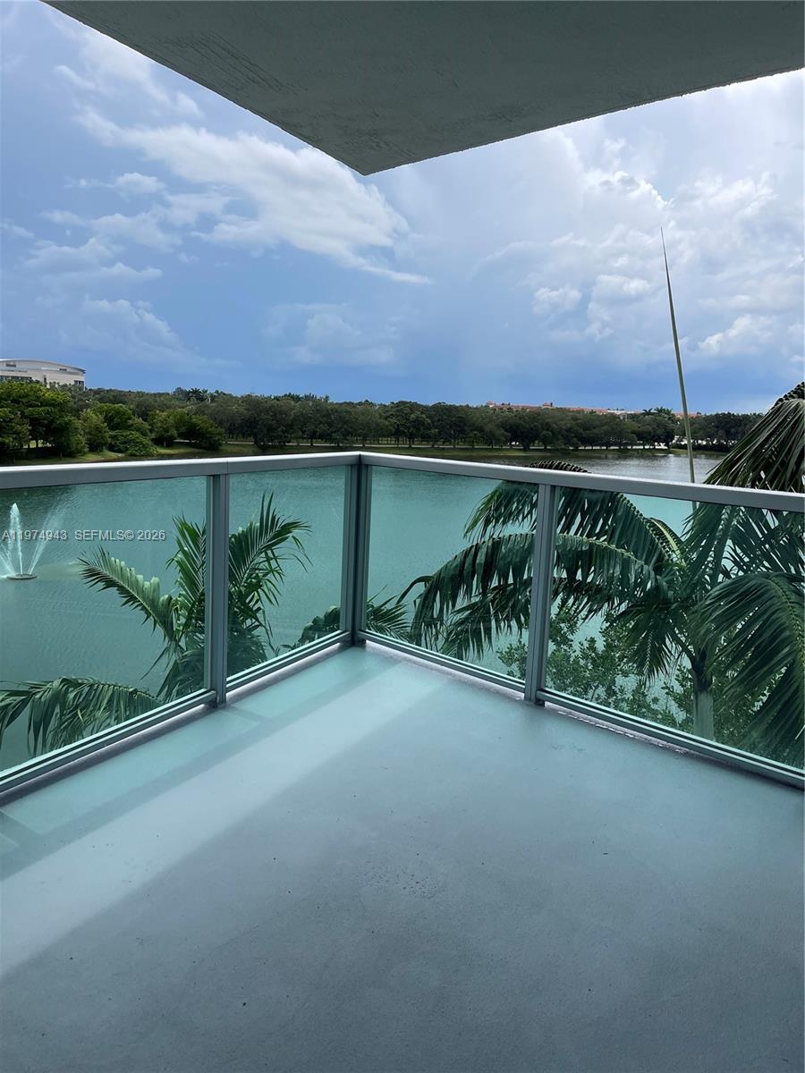 2681 North Flamingo Road, Unit 401S Sunrise, FL 33323 - Photo 2 of 18 a view of a lake with a mountain in the background