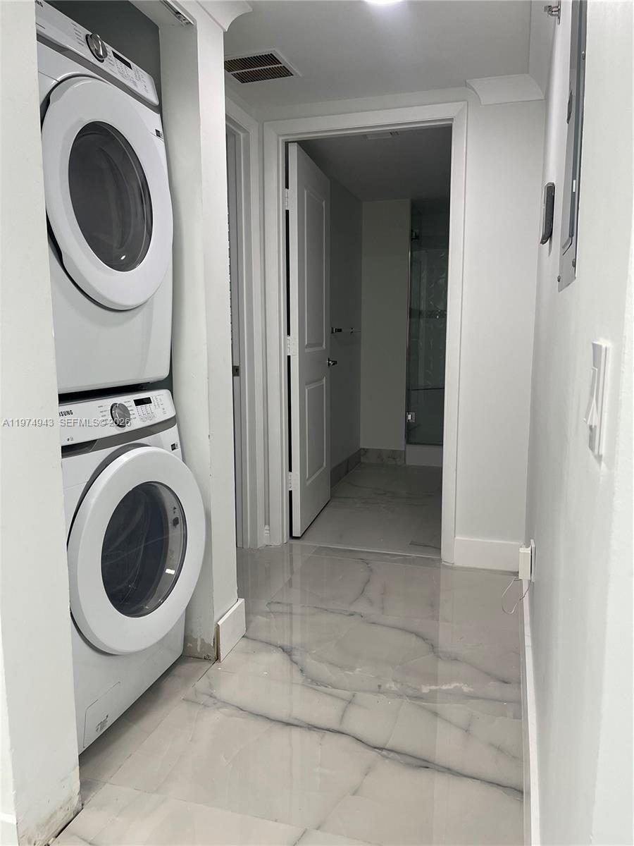 2681 North Flamingo Road, Unit 401S Sunrise, FL 33323 - Photo 8 of 18 a view of a hallway with washer and dryer