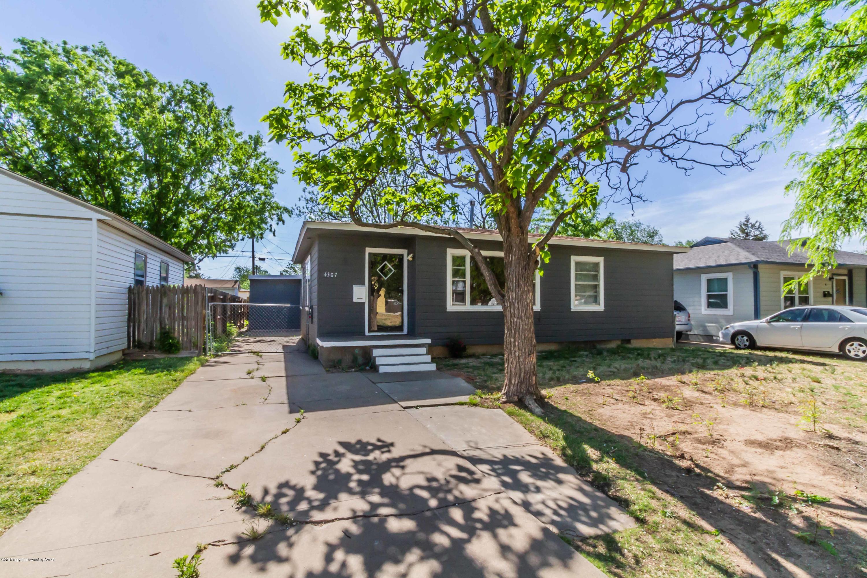4307 Gables Street Amarillo, TX 79110 - Photo 1 of 32 a front view of a house with yard patio and green space