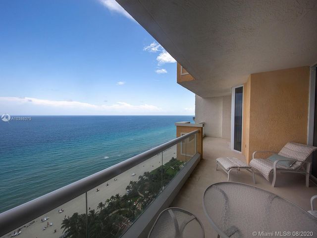 a view of balcony with furniture