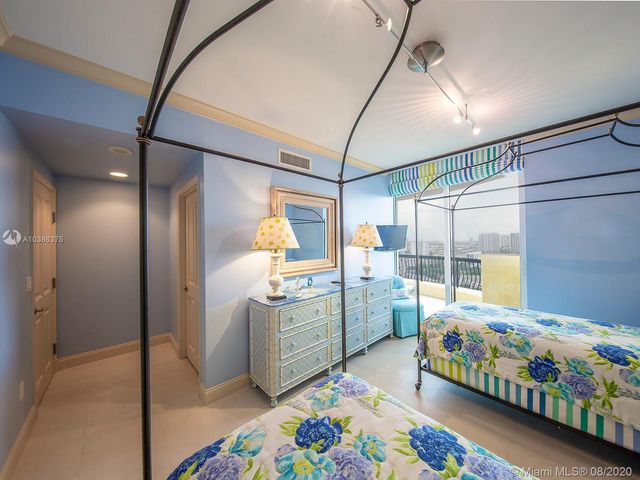 a bedroom with bed and a window