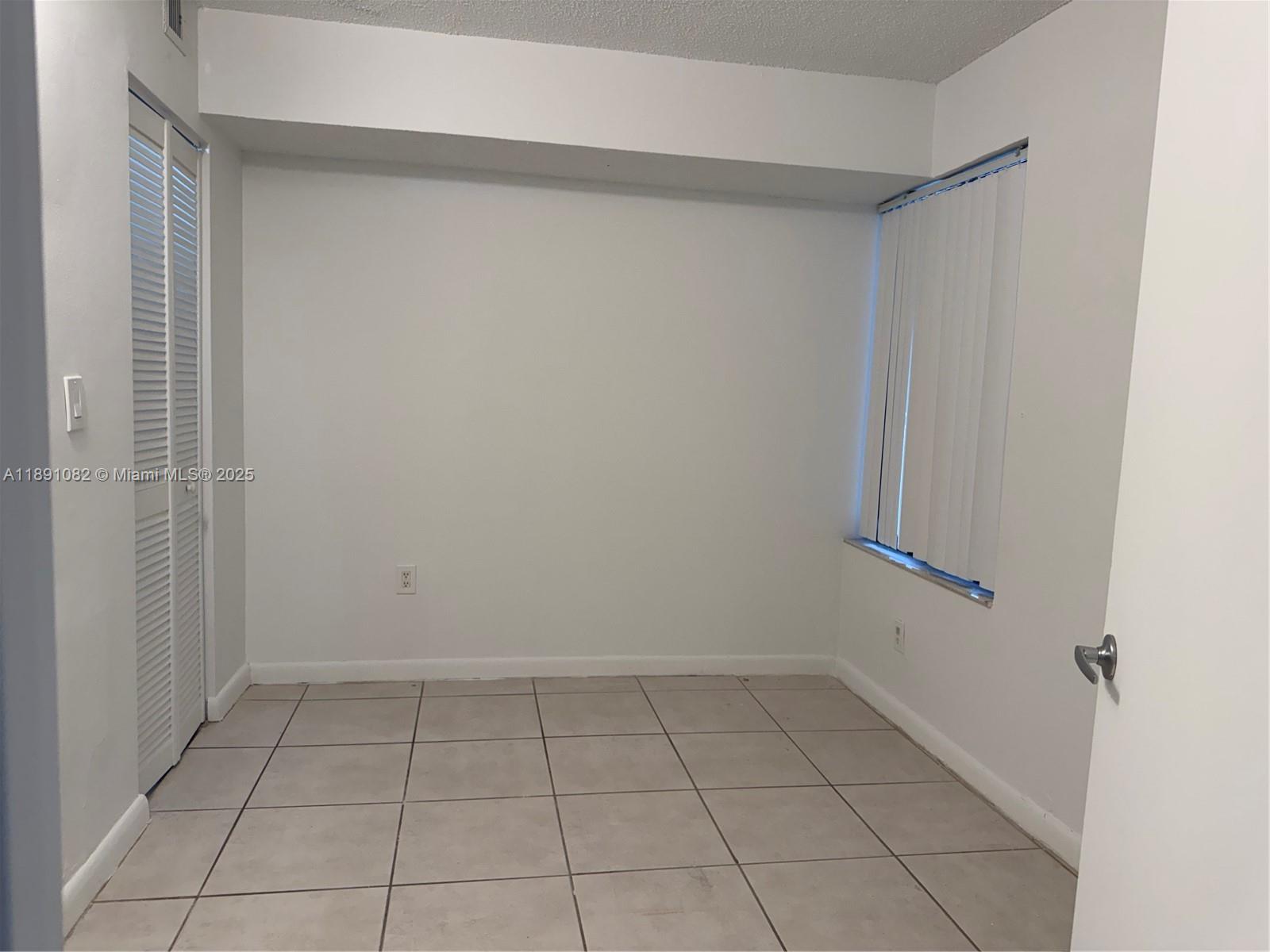 8275 Southwest 152nd Avenue, Unit D408 Miami, FL 33193 - Photo 4 of 9 a view of an empty room