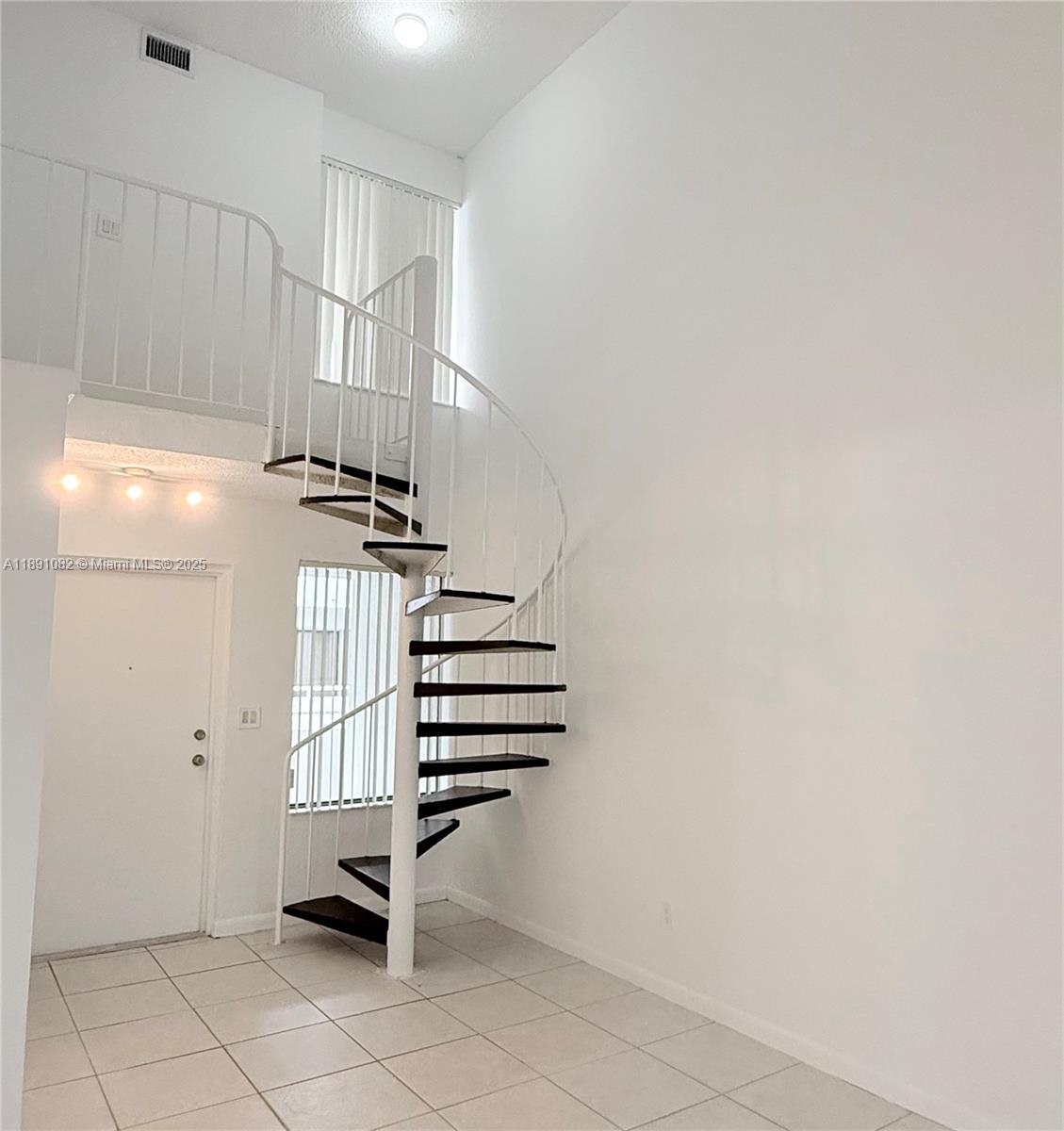8275 Southwest 152nd Avenue, Unit D408 Miami, FL 33193 - Photo 6 of 9 a view of entryway and hall with wooden floor