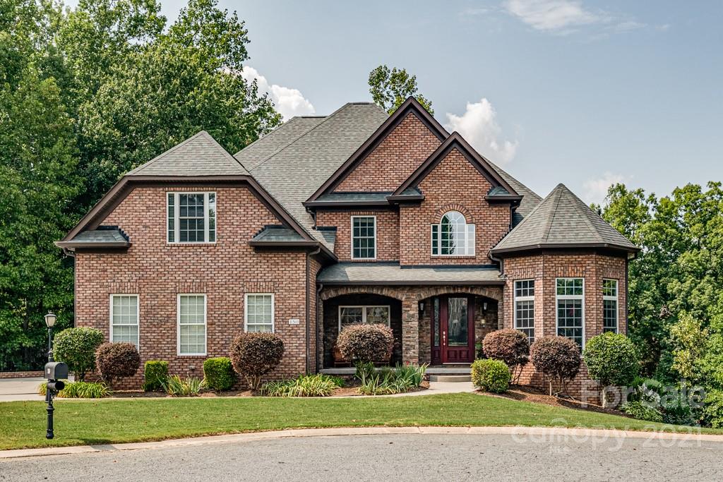 150 Canterbury Crossing Fort Mill, SC 29708 - Photo 1 of 48 a front view of a house with a garden and plants