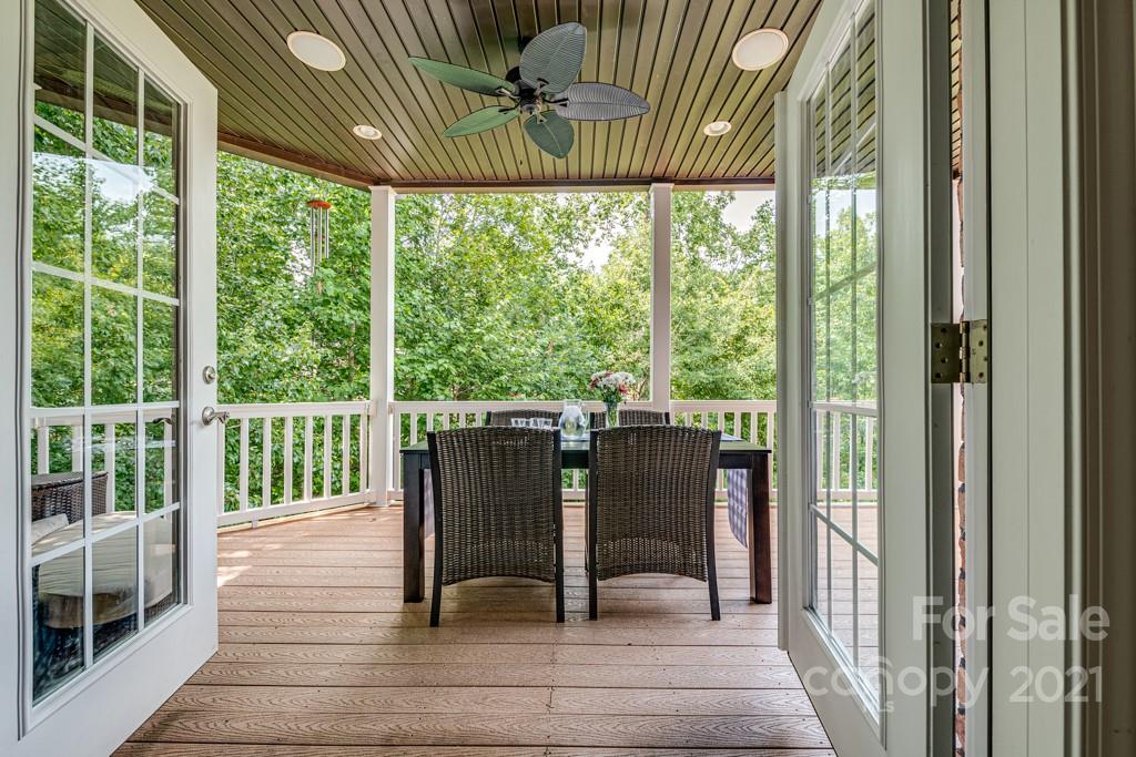 150 Canterbury Crossing Fort Mill, SC 29708 - Photo 12 of 48 a view of a porch with furniture and wooden floor