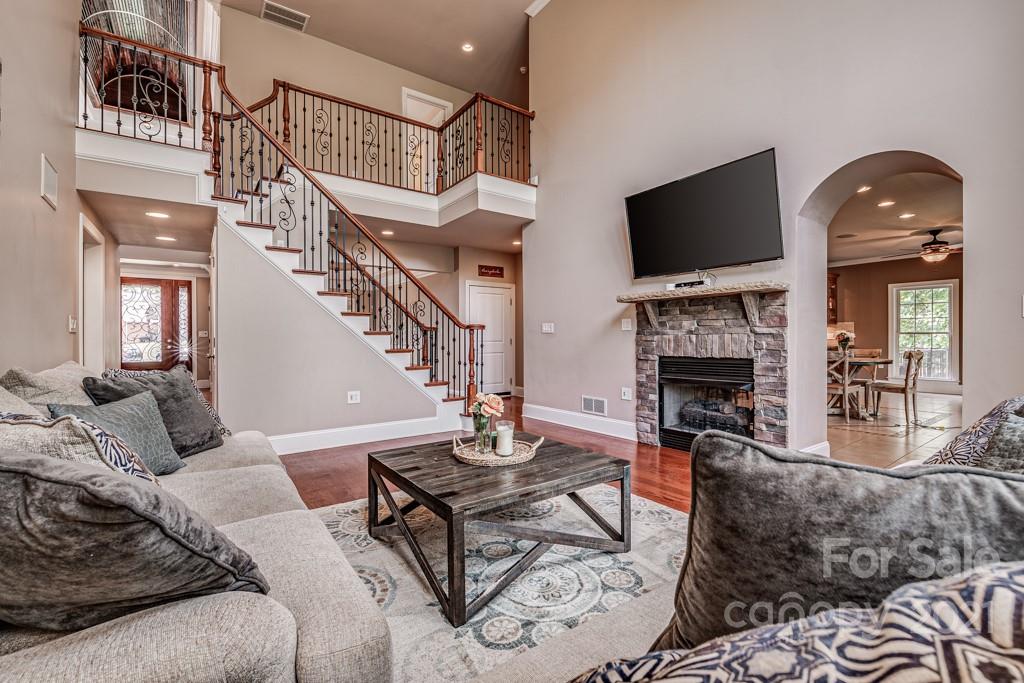 150 Canterbury Crossing Fort Mill, SC 29708 - Photo 15 of 48 a living room with furniture a flat screen tv and a fireplace