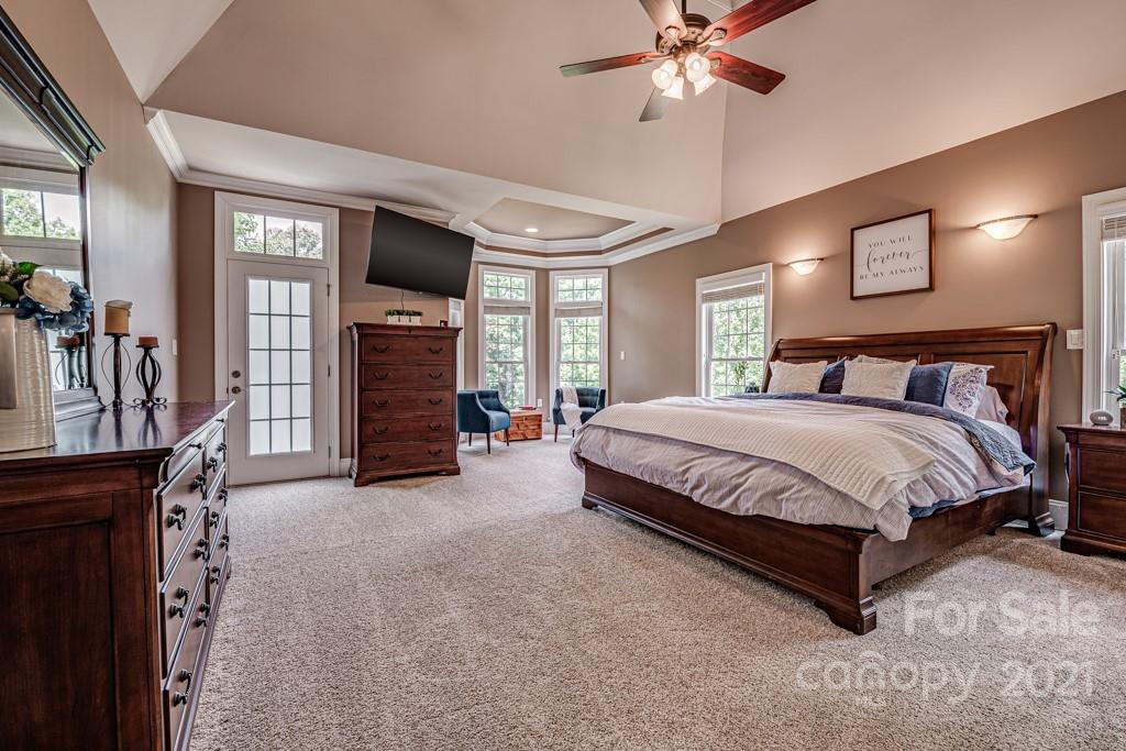 150 Canterbury Crossing Fort Mill, SC 29708 - Photo 17 of 48 a bedroom with a bed and flat screen tv