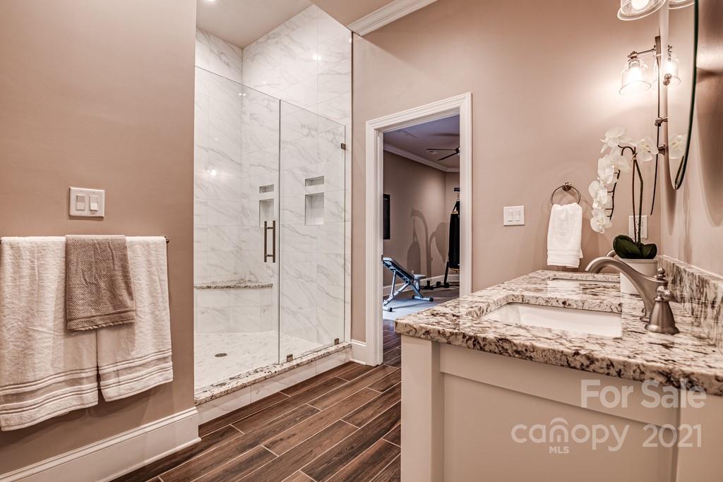 150 Canterbury Crossing Fort Mill, SC 29708 - Photo 29 of 48 a bathroom with a granite countertop sink and a mirror