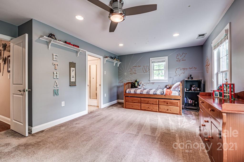 150 Canterbury Crossing Fort Mill, SC 29708 - Photo 32 of 48 a bed room with furniture and a ceiling fan