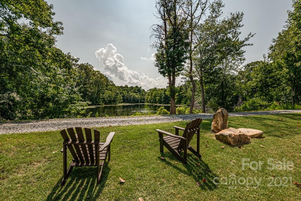 150 Canterbury Crossing Fort Mill, SC 29708 - Photo 35 of 48 a view of a swimming pool with a patio and a garden