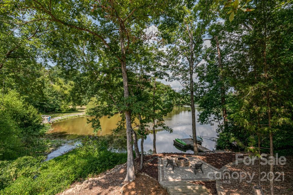 150 Canterbury Crossing Fort Mill, SC 29708 - Photo 40 of 48 a backyard of a house with a yard and outdoor seating