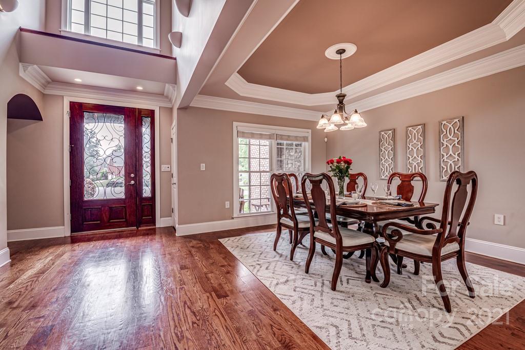 150 Canterbury Crossing Fort Mill, SC 29708 - Photo 5 of 48 a view of a dining room with furniture window and wooden floor
