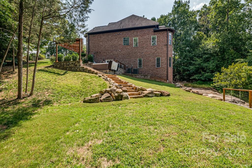 150 Canterbury Crossing Fort Mill, SC 29708 - Photo 46 of 48 a backyard of a house with yard and outdoor seating