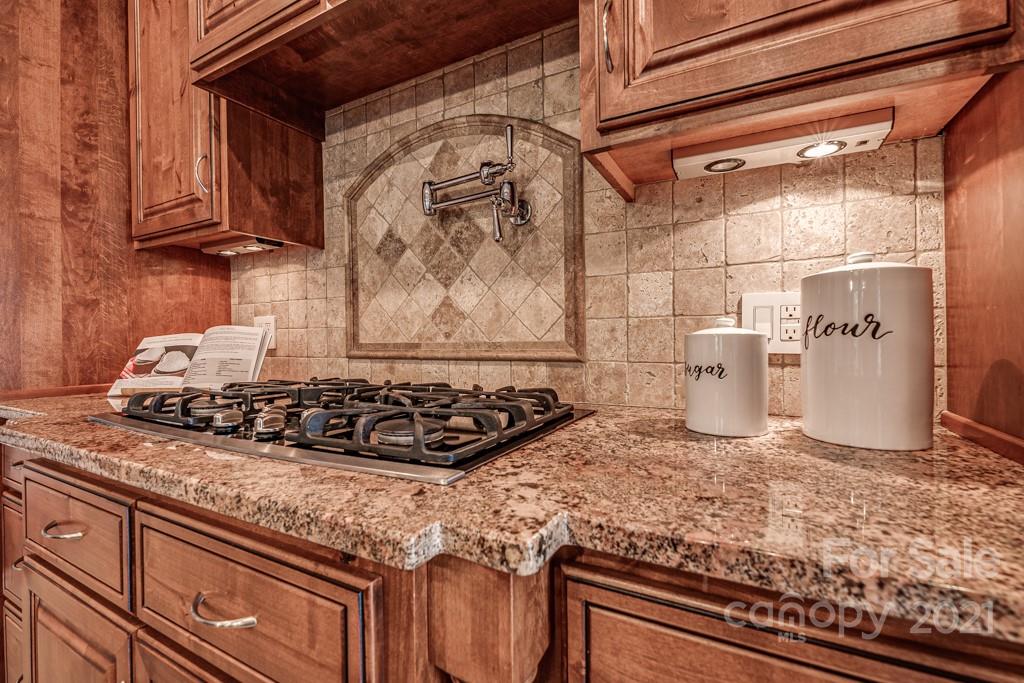 150 Canterbury Crossing Fort Mill, SC 29708 - Photo 7 of 48 a kitchen with a stove and cabinets