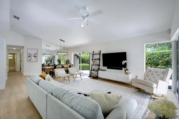 a view of a dining room with furniture window and wooden floor