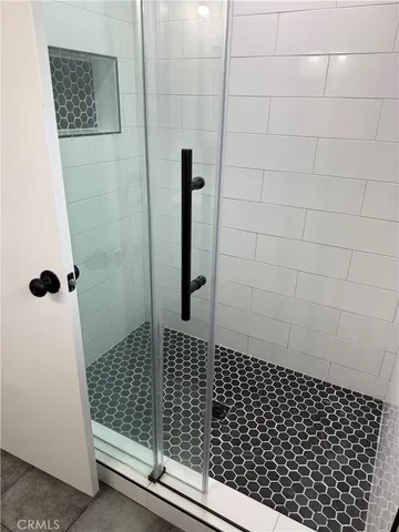 a bathroom with a sink vanity and mirror