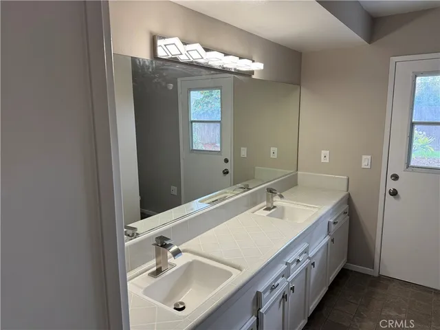 a white toilet sitting next to a shower