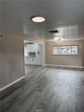 a view of a kitchen with a sink and a window