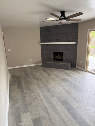 a view of an empty room with a fireplace