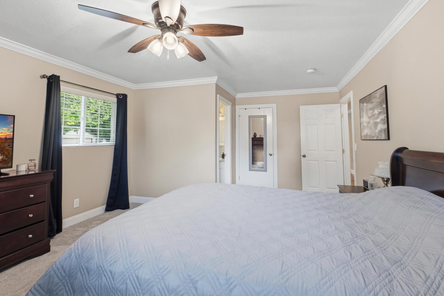 550 Bell Street Turlock, CA 95380 - Photo 17 of 36 a bedroom with a bed and a dresser