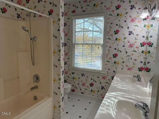 a bathroom with a bathtub and shower