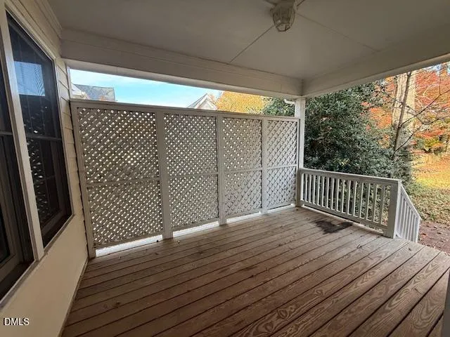 a view of deck with wooden floor and fence