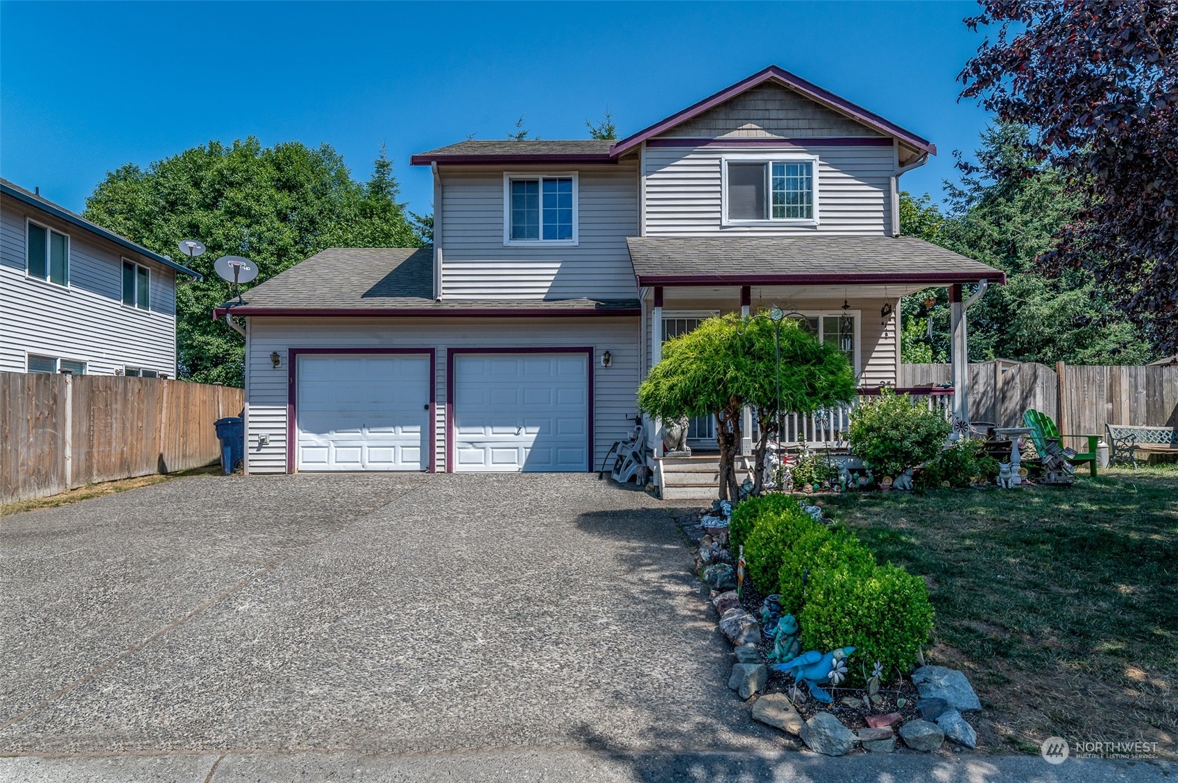 403 Rohrer Loop Sedro-Woolley, WA 98284 - Photo 1 of 24 a front view of a house with a yard and garage