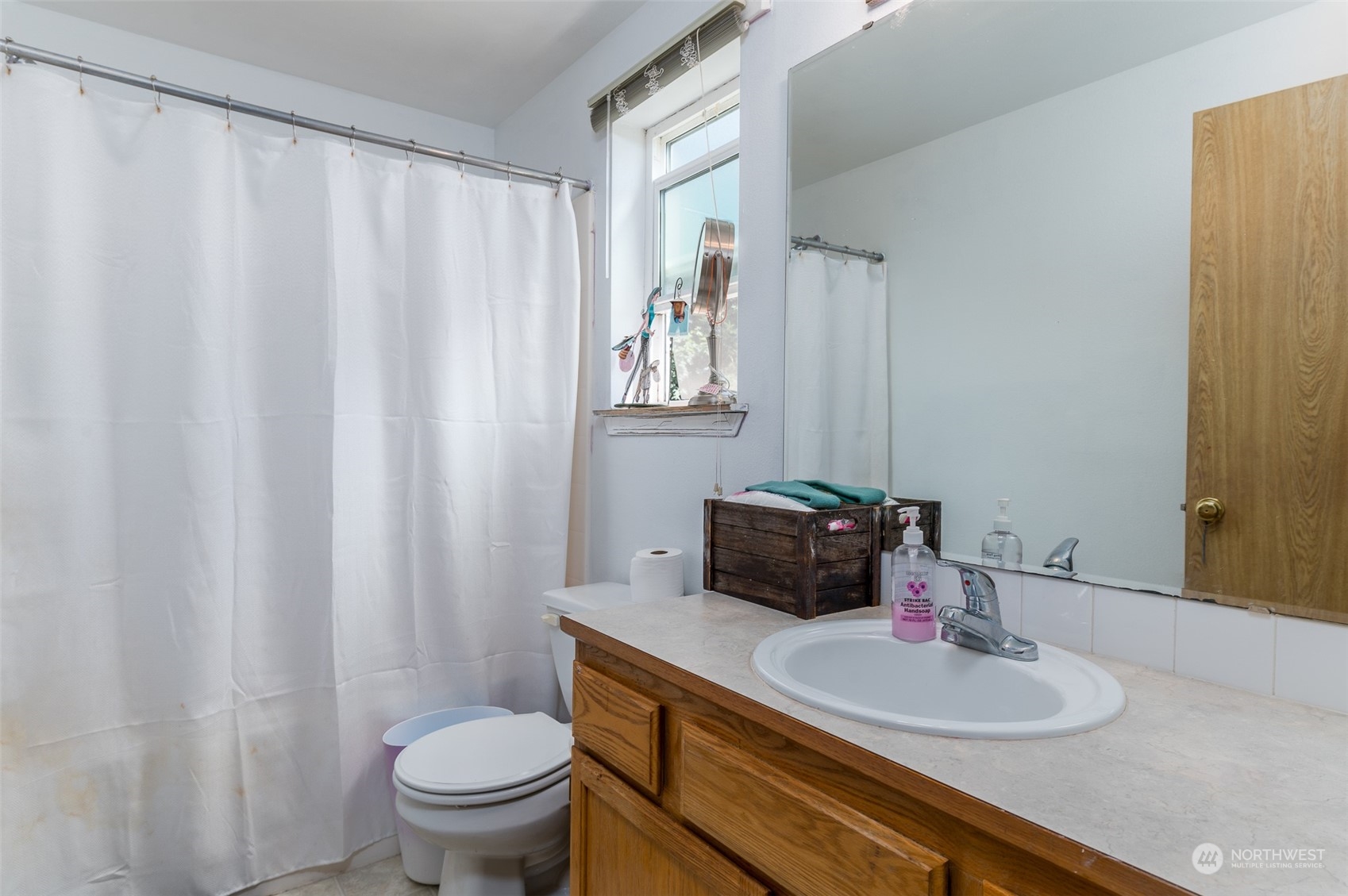 403 Rohrer Loop Sedro-Woolley, WA 98284 - Photo 11 of 24 a bathroom with a granite countertop sink and a toilet
