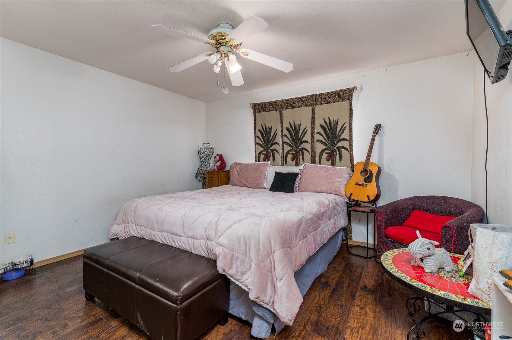 403 Rohrer Loop Sedro-Woolley, WA 98284 - Photo 13 of 24 a bedroom with a bed and wooden floor